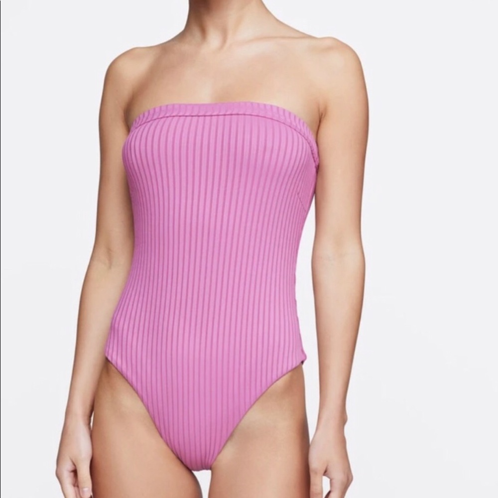 Cute lavender 1 piece bathing suit. Must know size